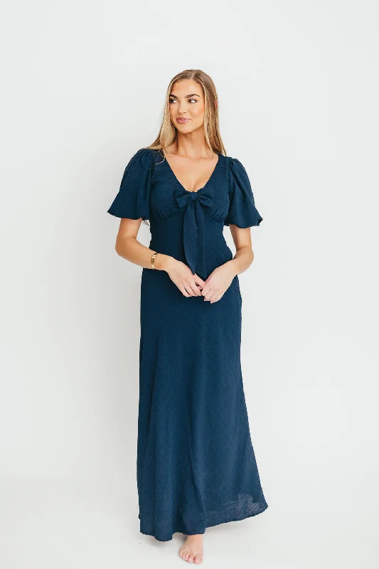 Midi dresses with pom - pom trims for a playful and festive look Selena Bow Front Maxi Dress in Navy Midi dresses with pom - pom trims for a playful and festive look Selena Bow Front Maxi Dress in Navy