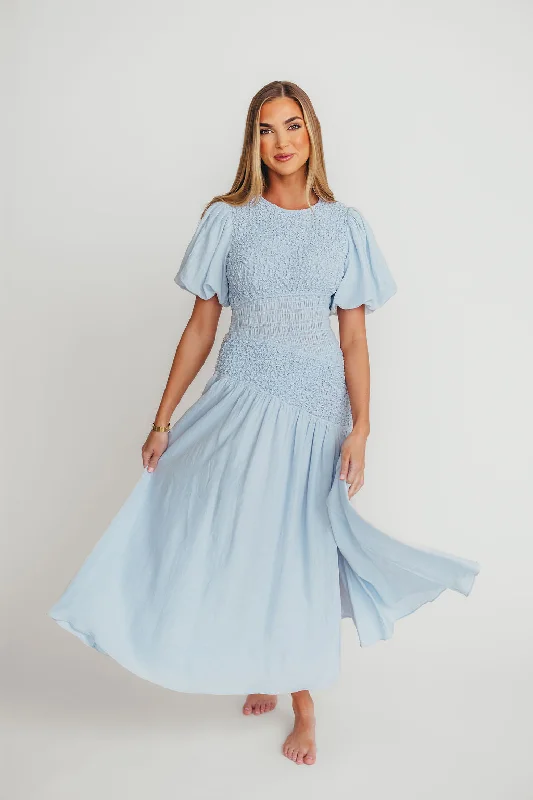 Midi dresses with animal prints for a bold and confident appearance Theoni Asymmetrical Smocked Dress in Blue Midi dresses with animal prints for a bold and confident appearance Theoni Asymmetrical Smocked Dress in Blue