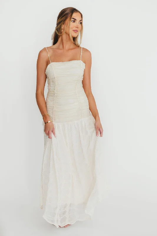 Velvet midi dresses in jewel tones for a glamorous winter event Rosie Ruched Maxi Dress With Bow Back Detail in Cream Velvet midi dresses in jewel tones for a glamorous winter event Rosie Ruched Maxi Dress With Bow Back Detail in Cream
