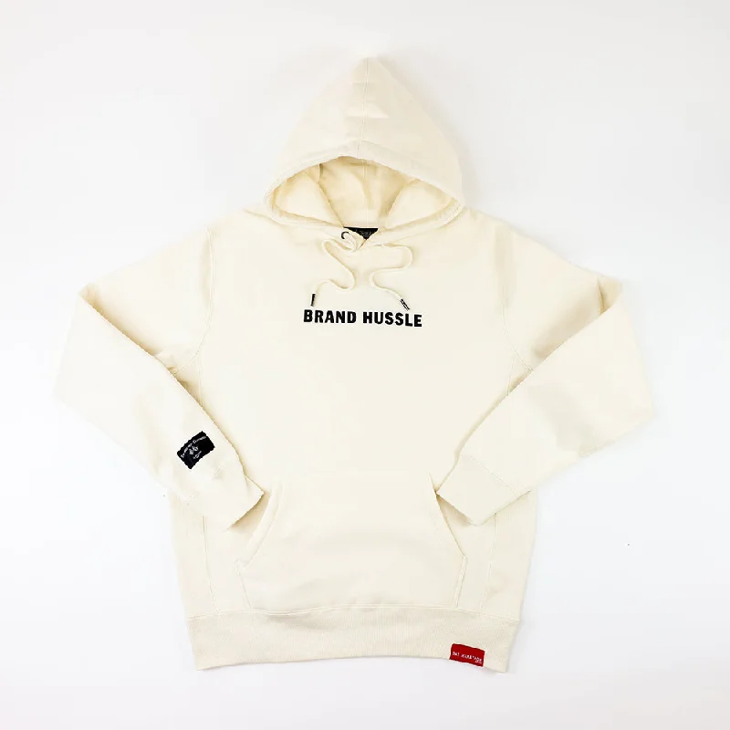 Women's cropped sweatshirt with a slogan graphic for a fun and expressive lookBrand Hussle (Victory Flags) Hoodie - Bone/Black Women's cropped sweatshirt with a slogan graphic for a fun and expressive lookBrand Hussle (Victory Flags) Hoodie - Bone/Black