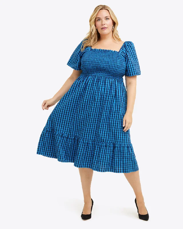 Midi dresses with keyhole backs for a flirty and unexpected detailDeana Smocked Dress in Blue Gingham Midi dresses with keyhole backs for a flirty and unexpected detailDeana Smocked Dress in Blue Gingham
