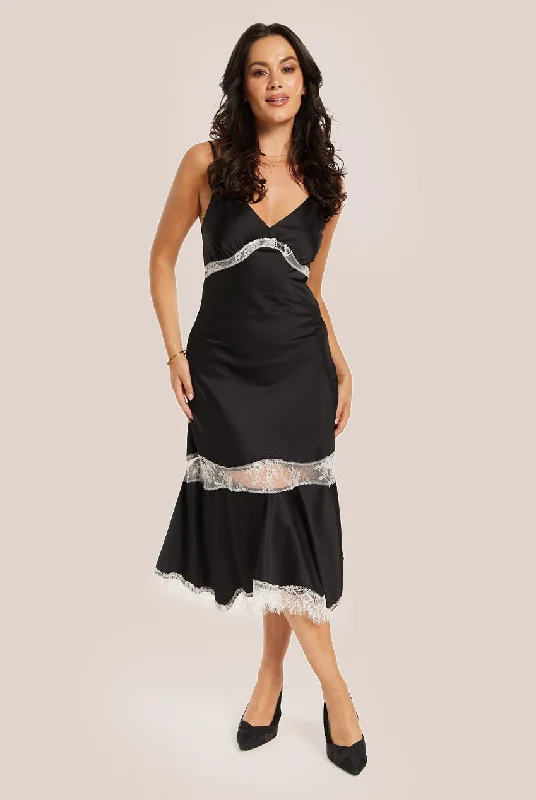 Midi dresses with geometric cutouts for a contemporary and edgy lookLiquorish Elegant Black Midi Dress With Lace Details Midi dresses with geometric cutouts for a contemporary and edgy lookLiquorish Elegant Black Midi Dress With Lace Details