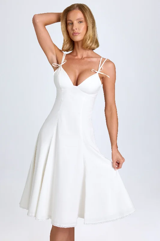 Midi dresses with tassel accents for a bohemian and free - spirited styleBow-Detail Lace-Trim A-Line Midi Dress in White Midi dresses with tassel accents for a bohemian and free - spirited styleBow-Detail Lace-Trim A-Line Midi Dress in White