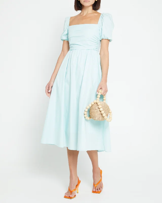 Midi dresses with ruffled sleeves for a more feminine and voluminous lookRiver Dress Midi dresses with ruffled sleeves for a more feminine and voluminous lookRiver Dress